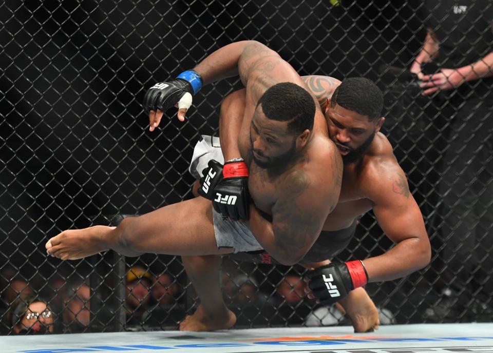 Mar 23, 2019; Nashville, TN, USA; Curtis Blaydes (red gloves) and Justin Willis (blue gloves) during UFC Fight Night at Bridgestone Arena. Mandatory Credit: Christopher Hanewinckel-USA TODAY Sports