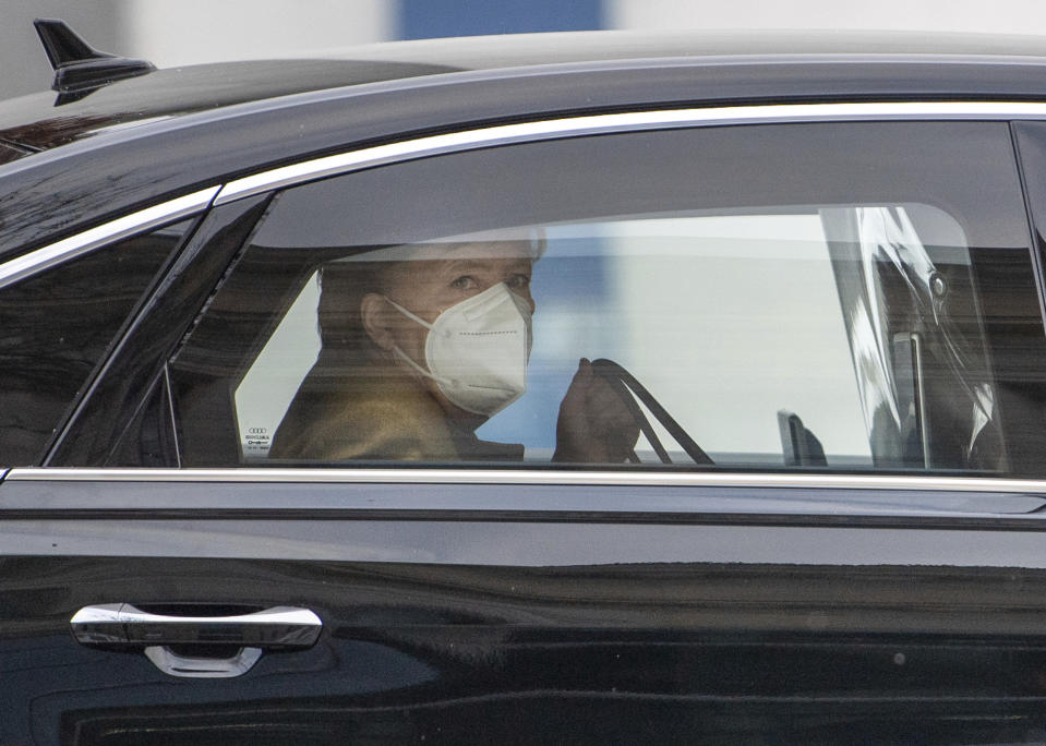 Federal Chancellor Angela Merkel arrives in front of the Bundestag, Berlin, Germany, Thursday, Feb.11, 2021. She delivers a government statement on the results of the federal-state round on the management of the Corona pandemic. (Dorothee Barth/dpa/dpa via AP)