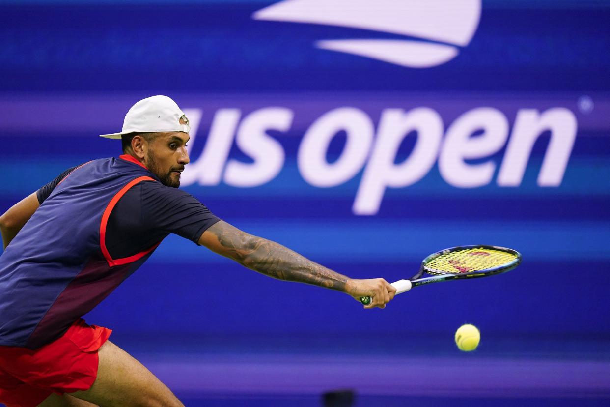 Nick Kyrgios, of Australia, returns a shot to Thanasi Kokkinakis, of Australia, during the first round of the U.S. Open tennis championship on Monday, Aug. 29, 2022, in New York.