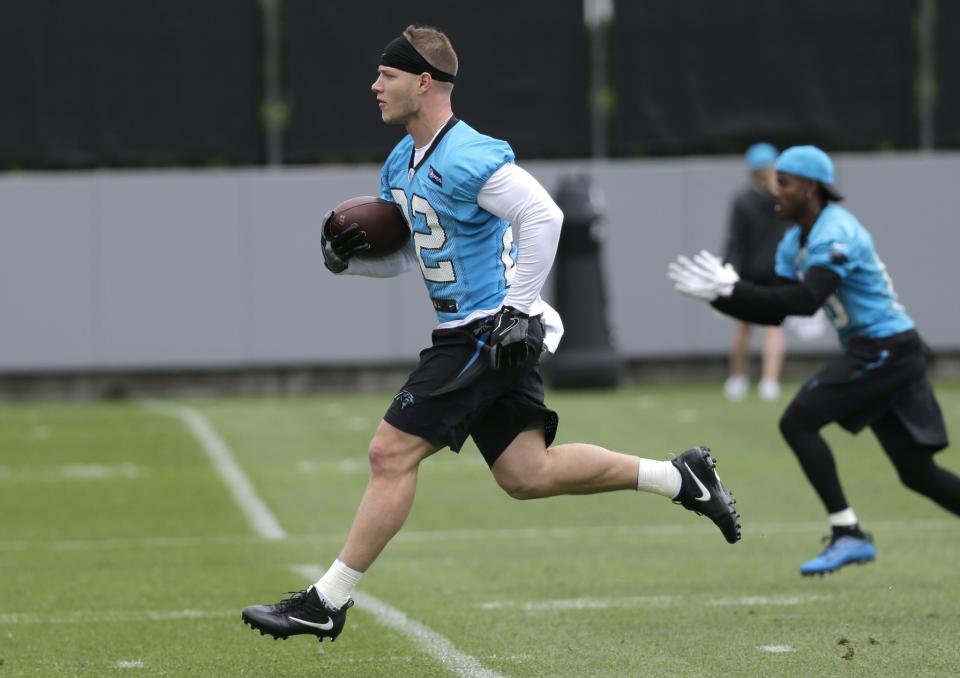 New Carolina Panthers running back Christian McCaffrey, left, at rookie minicamp. (AP)