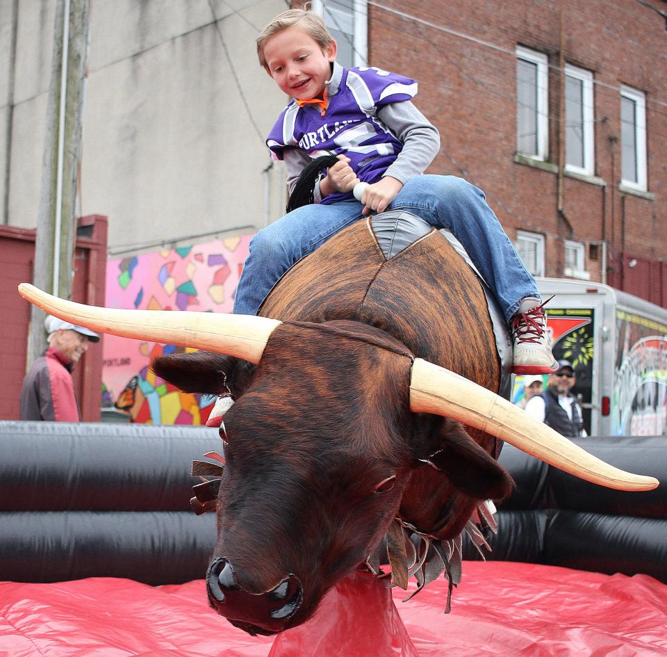 Isaiah Wims stays on the bull at Strawberry Fest on Saturday, May 8, 2021.