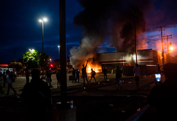 A fire burns inside of an Auto Zone store near the 3rd Police Precinct in Minneapolis, Minnesota. 