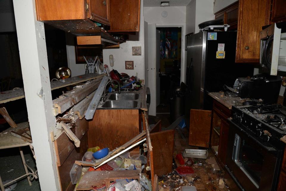 The destruction inside the Mason family's kitchen. / Credit: FBI
