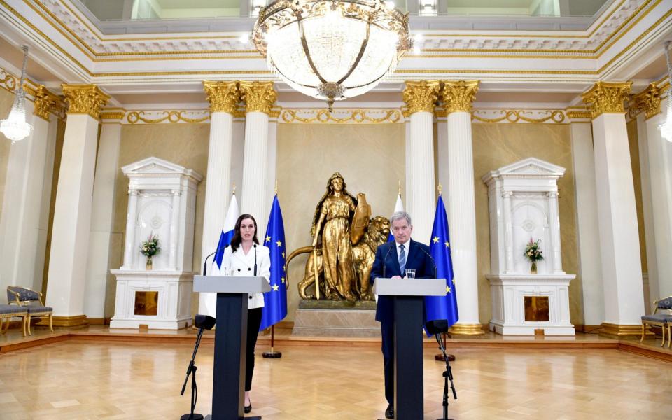 Finland's President Sauli Niinisto and Prime Minister Sanna Marin, left, attend the press conference on Finland's security policy decisions at the Presidential Palace in Helsinki, Finland, Sunday May 15, 2022.  - Heikki Saukkomaa/Lehtikuva