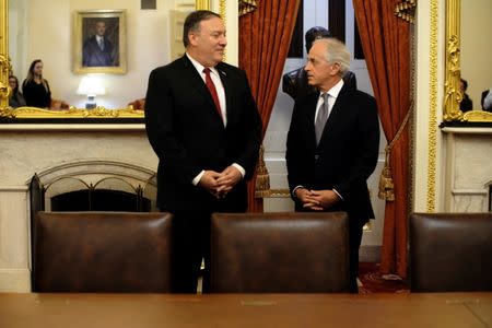 U.S. Senate Foreign Relations Committee Chairman Bob Corker (R-TN), R, meets with CIA Director Mike Pompeo, L, President Trump's nominee for Secretary of State, at the U.S. Capitol in Washington March 19, 2018. REUTERS/James Lawler Duggan
