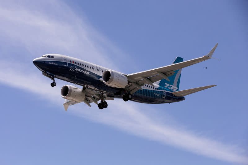 FILE PHOTO: FILE PHOTO: A Boeing 737 MAX airplane lands after a test flight at Boeing Field in Seattle