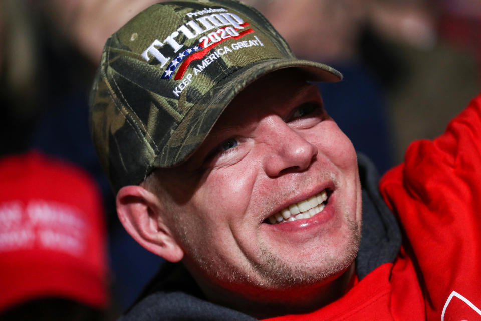 A supporter wearing a Trump 2020 hat attends U.S. President Donald Trump's campaign rally in Battle Creek, Michigan, U.S., December 18, 2019. REUTERS/Leah Millis?