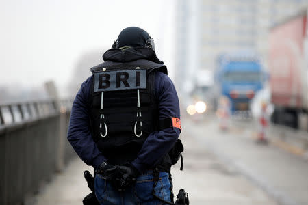 A member of French special police forces of Research and Intervention Brigade (BRI) patrols at the French-German border the day after a shooting in Strasbourg, France, December 12, 2018. REUTERS/Vincent Kessler
