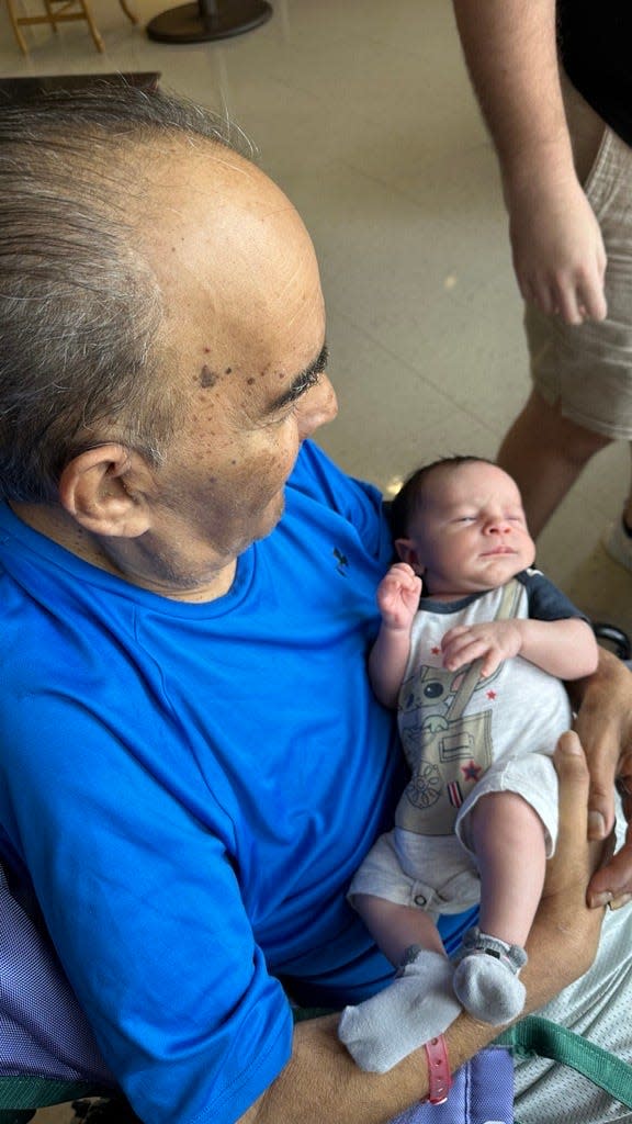 USA TODAY Sports editor Joe Rivera's dad, Jose, meets grandson Remy. Separated by 69 years, they share Jets fandom all the same.