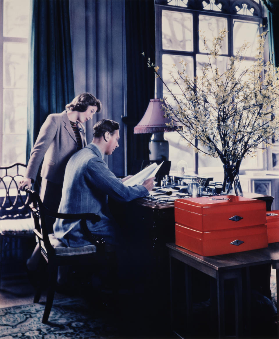 11th April 1942:  Princess Elizabeth talking to her father, King George VI whilst he goes through the Royal boxes in a study at Windsor Castle, Berkshire.  (Photo by Lisa Sheridan/Studio Lisa/Hulton Archive/Getty Images)