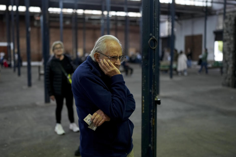 People line up to vote during general elections in Buenos Aires, Argentina, Sunday, Oct. 22, 2023. (AP Photo/Mario De Fina)