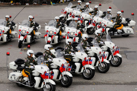 Military police perform on their motorcycles during the National Day celebrations in Taipei, Taiwan October 10, 2018. REUTERS/Tyrone Siu