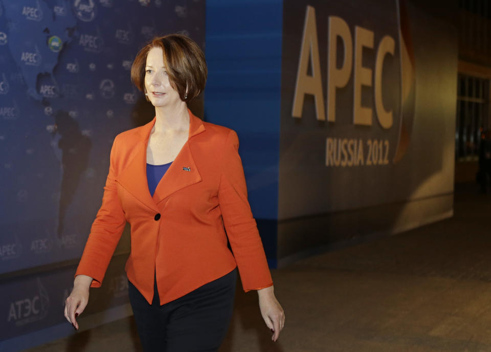 Australian Prime Minister Julia Gillard walks from her car to a press conference at the APEC summit in Vladivostok, Russia, Friday, Sept. 7, 2012. (AP Photo/Mark Baker)