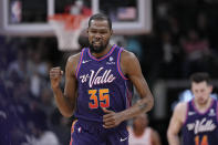 Phoenix Suns forward Kevin Durant (35) reacts after scoring against the San Antonio Spurs during the second half of an NBA basketball game in San Antonio, Monday, March 25, 2024. (AP Photo/Eric Gay)