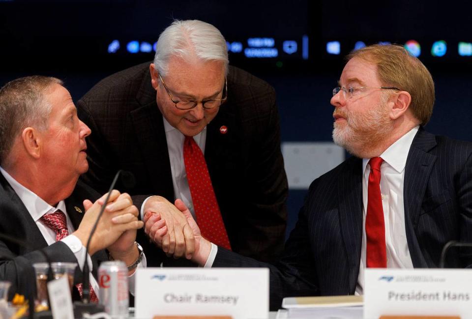 N.C. State Chancellor Randy Woodson shakes hands with UNC System President Peter Hans following a committee meeting on Wednesday, Jan. 24, 2024, in Raleigh, N.C. Kaitlin McKeown/kmckeown@newsobserver.com