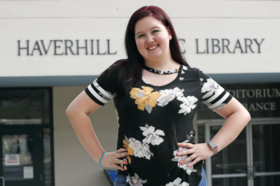 Kayleigh Bergh, of Haverhill, Mass., poses outside the polling station, Thursday, July 16, 2020, where she will be working on Election Day in Haverhill. State and local election officials across the country are trying to recruit younger workers to staff polling places on Election Day in November. The effort is driven by concern that many traditional poll workers will be too worried about catching the coronavirus to show up. (AP Photo/Charles Krupa)