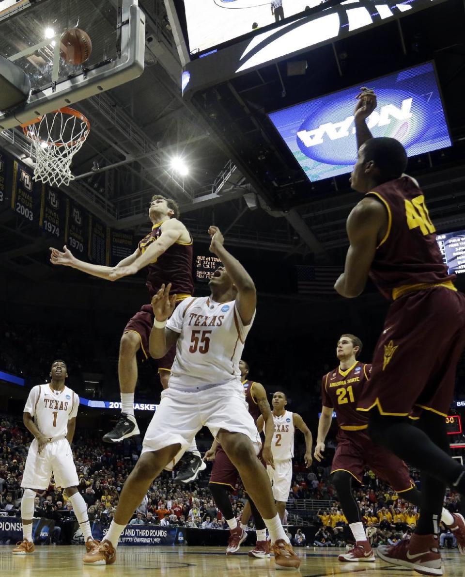 Texas center Cameron Ridley (55) watches his game winning shot against Arizona State during the second half of a second-round game in the NCAA college basketball tournament Thursday, March 20, 2014, in Milwaukee. Texas won 87-85. (AP Photo/Morry Gash)