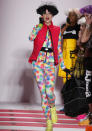 <b>New York Fashion AW13: Weird and wonderful runway looks<br></b><br>As well as putting on a yoga class on the catwalk, this model shows off a real neon look - fun, but not something we'll have in our wardrobes soon.<b><br></b>