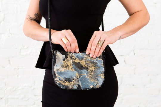 Marbled spray paint is the perfect addition to an old bag. 