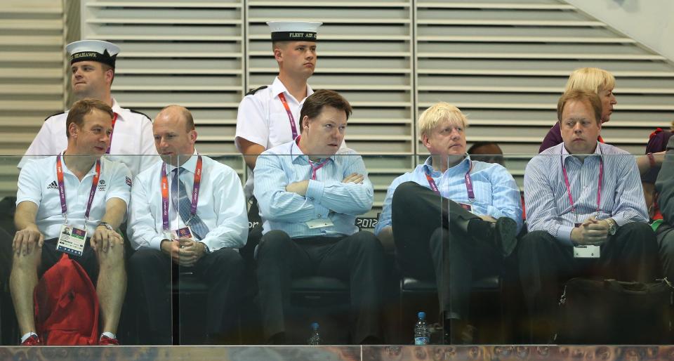 Mayor of London Boris Johnson (second right) watches Great Britain's Tom Daley and Peter Waterfield compete in the Men's Synchronised 10m Platform competition at the Aquatics Centre in the Olympics Park during the third day of the London 2012 Olympics.