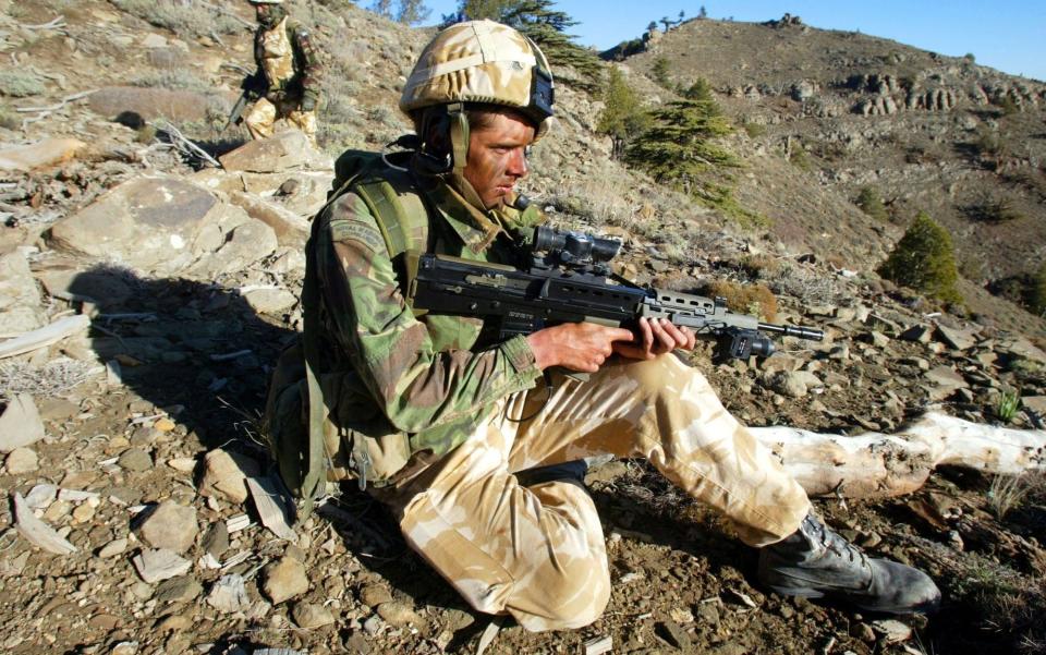 Royal Marines in action in eastern Afghanistan in 2002 - GETTY IMAGES