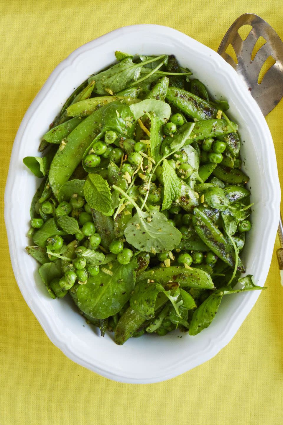 <p>Break out the cast-iron skillet for this minty pesto pea salad. With hints of garlic, parsley, and lemon, this summer dish will tingle all of your tastebuds. </p><p><a href="https://www.womansday.com/food-recipes/food-drinks/a19122134/blistered-pea-salad-with-mint-pesto-recipe/" rel="nofollow noopener" target="_blank" data-ylk="slk:Get the recipe for Blistered Pea Salad with Mint Pesto.;elm:context_link;itc:0;sec:content-canvas" class="link "><em>Get the recipe for Blistered Pea Salad with Mint Pesto.</em></a></p>