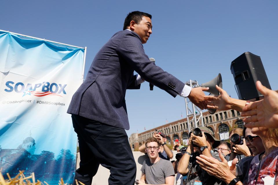 Democratic presidential candidate and entrepreneur Andrew Yang greets supporters before speaking at the Des Moines Register Soapbox during a visit to the Iowa State Fair, Friday, Aug. 9, 2019, in Des Moines, Iowa.