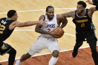 Los Angeles Clippers forward Kawhi Leonard (2) drives between Memphis Grizzlies guard Desmond Bane (22) and center Xavier Tillman (2) during the second half of an NBA basketball game Friday, Feb. 26, 2021, in Memphis, Tenn. (AP Photo/Brandon Dill)