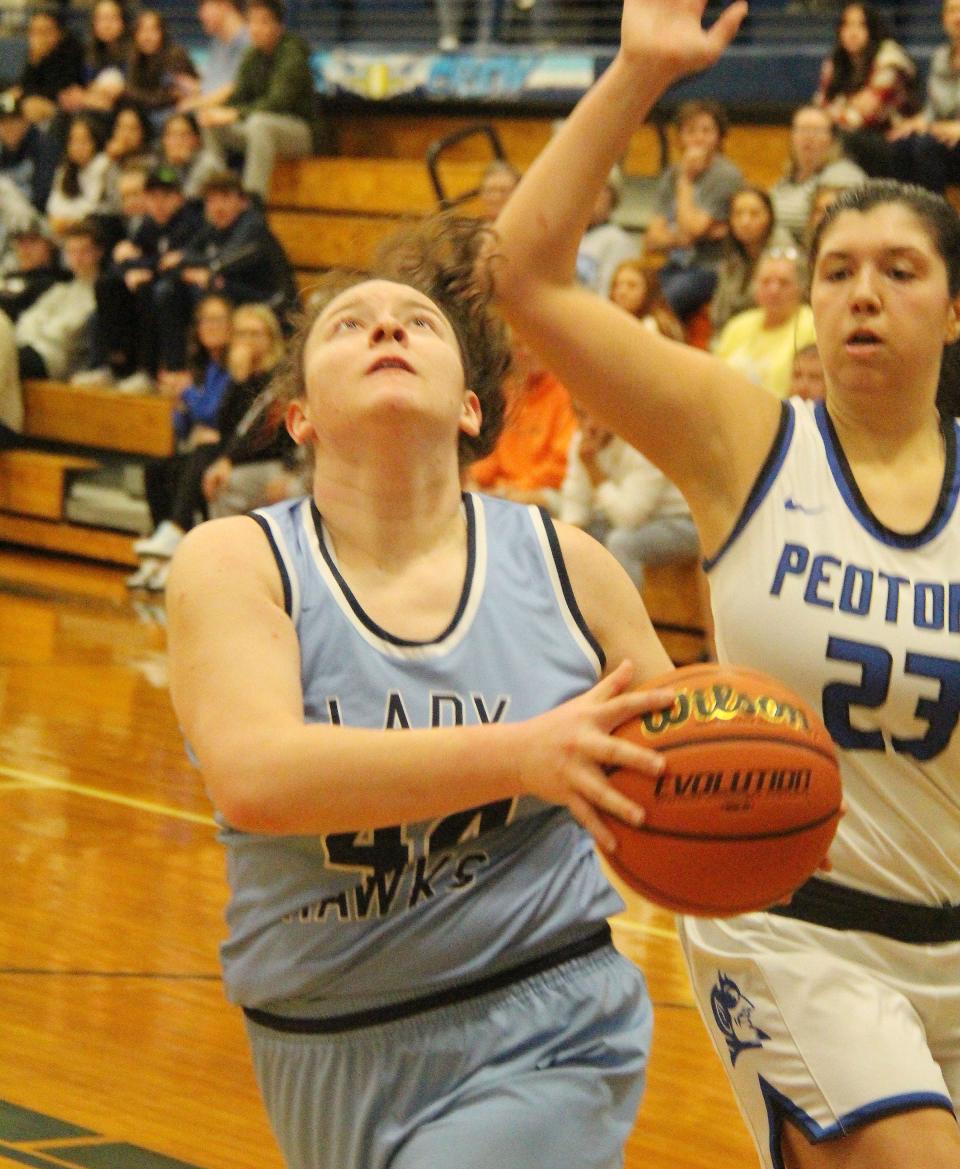 Carmen Gradberg drives to take a shot against Peotone in Prairie Central's regional final contest Friday, Feb. 17. Gradberg had 8 points in a losing effort.