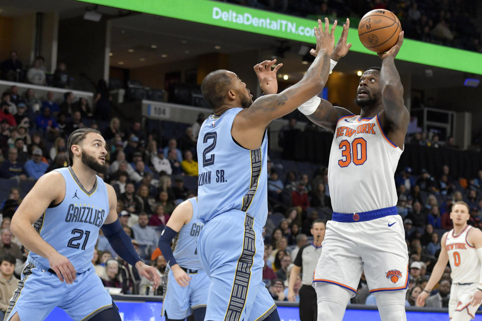 New York Knicks forward Julius Randle (30) shoots against Memphis Grizzlies forward Xavier Tillman (2) during the first half of an NBA basketball game Saturday, Jan. 13, 2024, in Memphis, Tenn. (AP Photo/Brandon Dill)