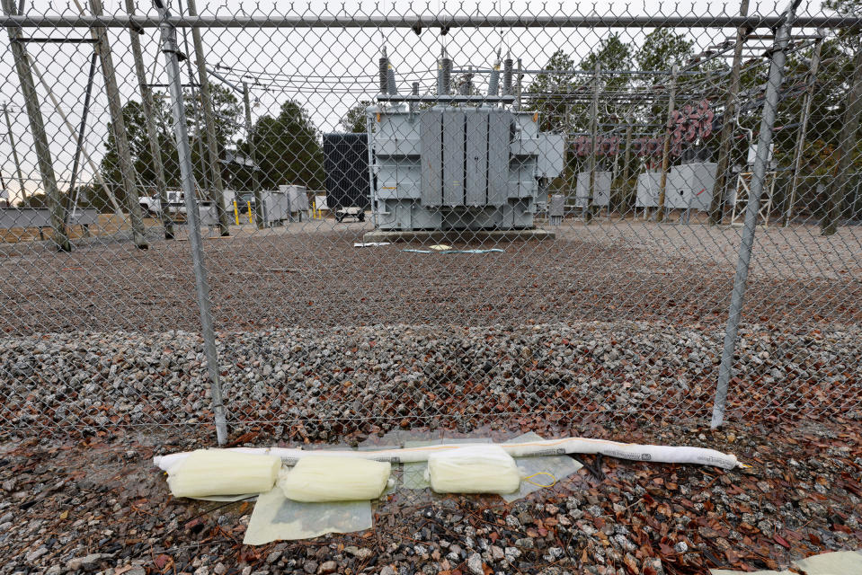 Barriers designed to absorb oil are placed near a damaged transformer that Duke Energy workers said was hit by gunfire that crippled an electrical substation after the Moore County Sheriff said that vandalism caused a mass power outage, in Carthage, North Carolina, U.S. December 4, 2022.<span class="copyright">Jonathan Drake—REUTERS</span>