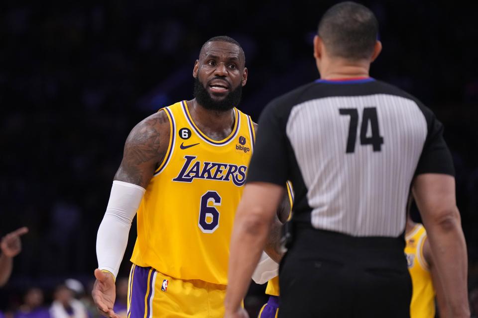 Lakers' LeBron James talks to referee Curtis Blair about a play in Game 5.