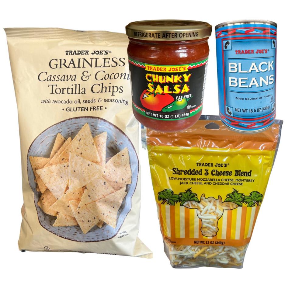 A yellow bag of tortilla chips, a jar of salsa, a can of black beans, and a yellow bag of shredded cheese