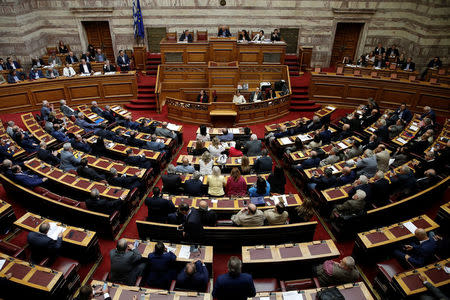 Greek Prime Minister Alexis Tsipras addresses lawmakers before a parliamentary vote of a law that allows citizens to declare a gender change on official documents in Athens, Greece October 10, 2017. REUTERS/Costas Baltas