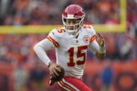 Kansas City Chiefs quarterback Patrick Mahomes (15) scrambles against the Denver Broncos during the first half of an NFL football game Saturday, Jan. 8, 2022, in Denver. (AP Photo/David Zalubowski)