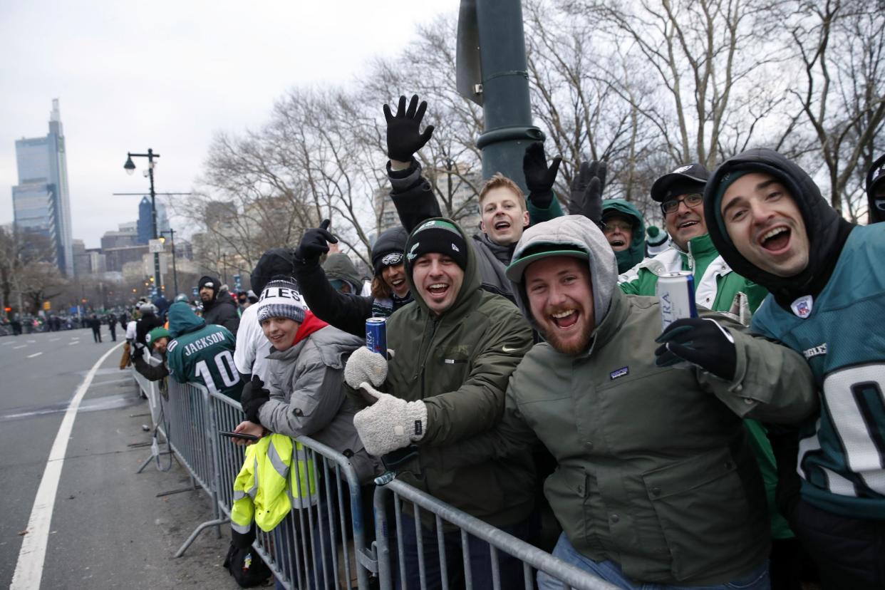 Eagles fans line the streets along the parade route: AP
