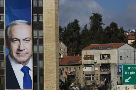 A Likud party campaign banner depicting Israel's Prime Minister Benjamin Netanyahu hangs on a building in Jerusalem March 3, 2015. REUTERS/Ronen Zvulun