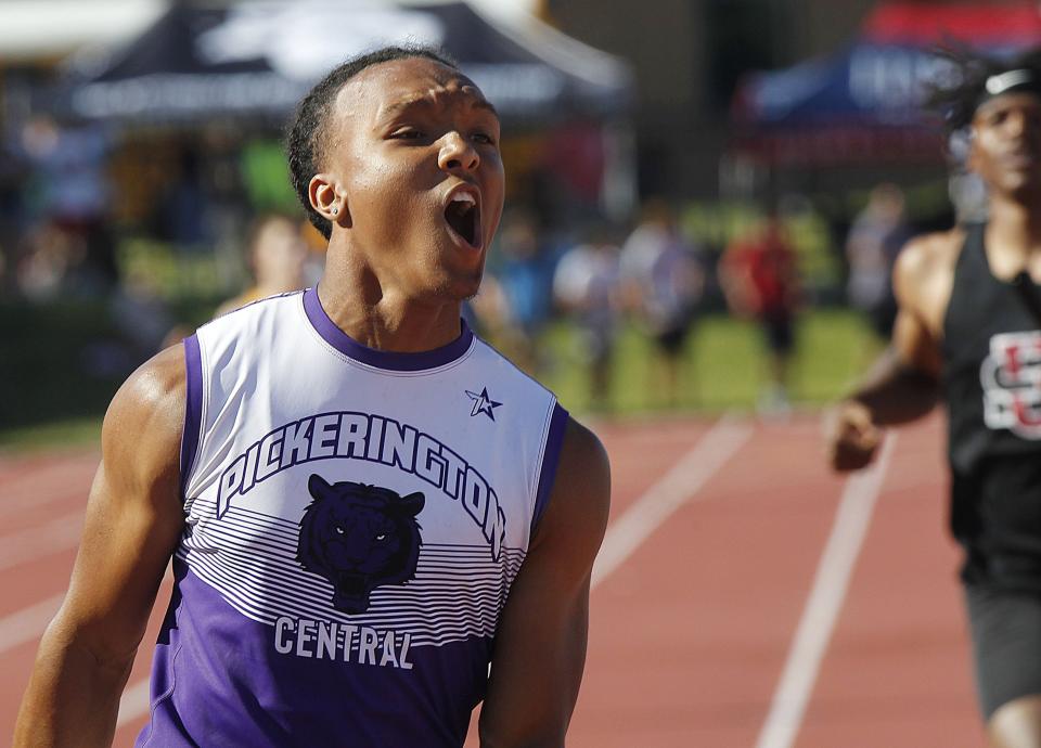 Pickerington Central's Troy Lane celebrates after he and teammates Xavier McCoy, Kaleb Holloway and Ethan Pinkins win the 4x100 meter relay at the Division I State Track and Field Championship at Jesse Owens Memorial Stadium on June 4.