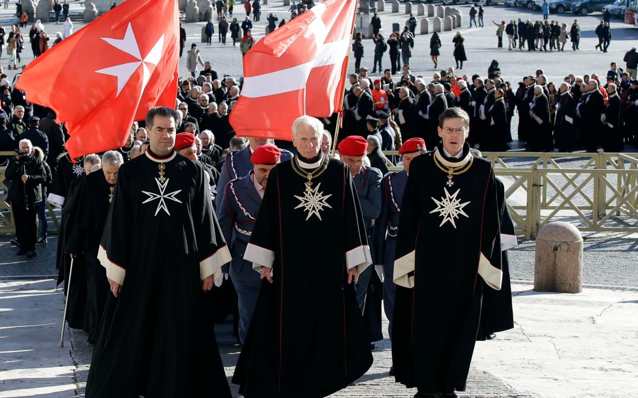 Members of the Knights of Malta walk in procession towards St. Peter's Basilica during a celebration to mark the 900th anniversary of the order at the Vatican in 2013.  - AP