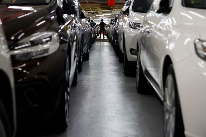 Cars for sale are parked at used car dealerships in Singapore