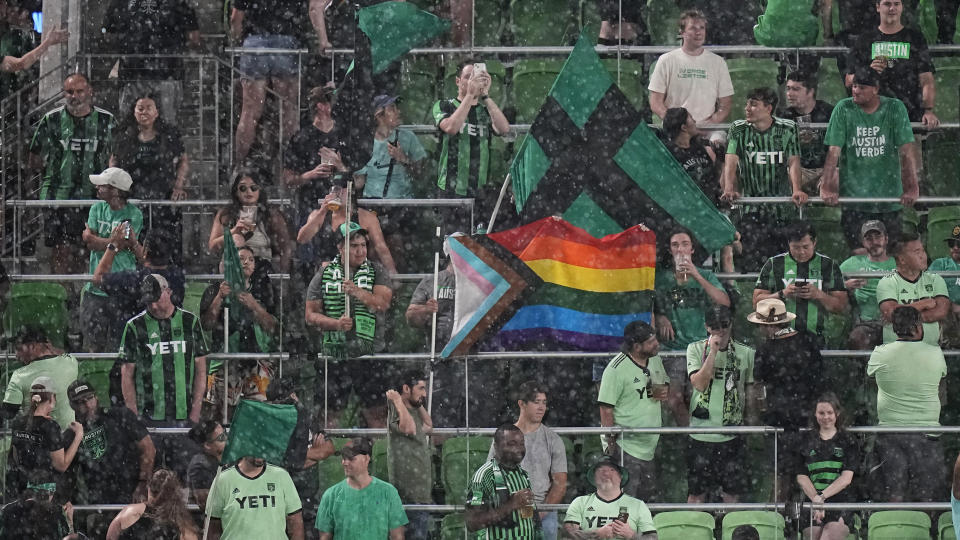 Fans wait during a rain delay in the first half of an MLS soccer match between Austin FC and Real Salt Lake in Austin, Texas, Saturday, June 3, 2023. (AP Photo/Eric Gay)