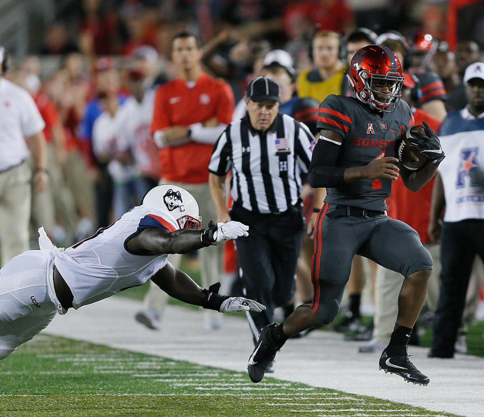 HOUSTON, TX - SEPTEMBER 29: Greg Ward Jr. #1 of the Houston Cougars runs out of bounds as Junior Joseph #11 of the Connecticut Huskies dives for a tackle. (Getty Images)