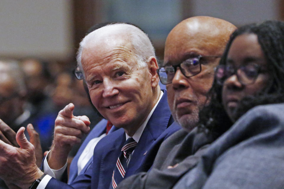 Democratic presidential candidate and former Vice President Joe Biden, left, gestures while seated next to U.S. Rep. Bennie Thompson, D-Miss., prior to speaking at New Hope Baptist Church, Sunday, March 8, 2020, in Jackson, Miss. Seated right, is Thompson's daughter, B.J. Thompson. (AP Photo/Rogelio V. Solis)