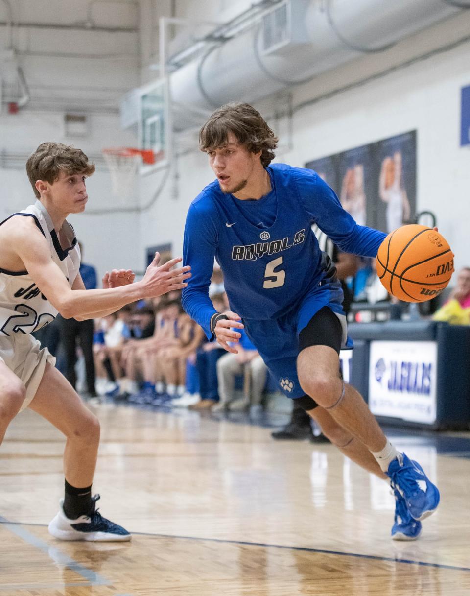 Tucker  Nowling (5) drives to the hoop during the Jay vs Central boys basketball game at Central High School in Milton on Friday, Jan. 13, 2023.