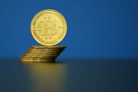 Bitcoin (virtual currency) coins are seen in an illustration picture taken at La Maison du Bitcoin in Paris, France, May 27, 2015. REUTERS/Benoit Tessier