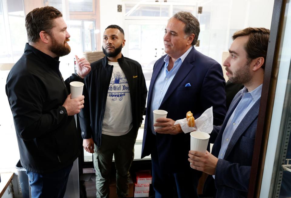 (L to R) Paddy Lynch, owner of Dutch Girl Donuts in Detroit, talks with his general manager Carmelo Gonzalez, 31, Nicholas Becharas, the CEO and president of Becharas Brothers Coffee Co., and his son Nick Becharas who is the vice president of operations during the store's soft opening on Friday, May 3, 2024.
Becharas Brothers Coffee Co. is supplying the famous donut shop with a special blend of coffee.