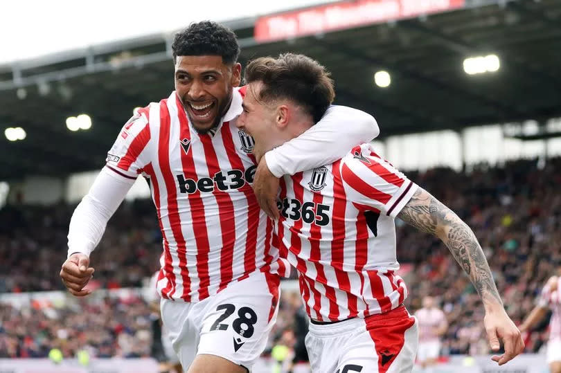 Luke Cundle celebrates with team-mate Josh Laurent during the Sky Bet Championship match between Stoke City and Bristol City at the bet365 Stadium.