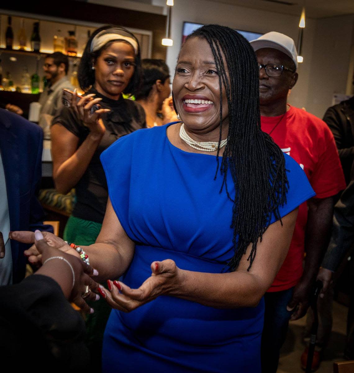 Marleine Bastien greets supporters at her election night party at the Holiday Inn at 7927 NW Seventh Ave. in Miami. She won the District 2 seat on the Miami-Dade County Commission.