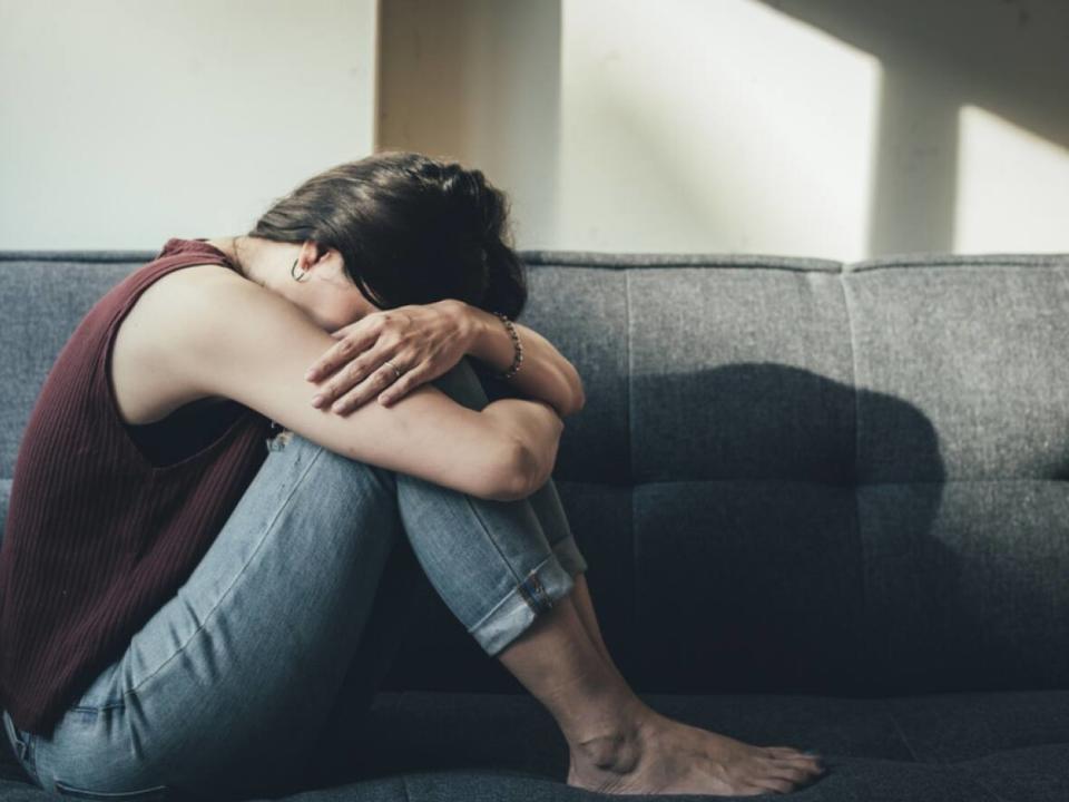 Loneliness from isolation, guilt from potentially infecting others, and anxiety around what could happen when you're ill with COVID-19 are all completely normal feelings, says psychologist Dr. Carla Fry — but there are ways to minimize the virus' toll on mental health. (Shutterstock/panitanphoto - image credit)