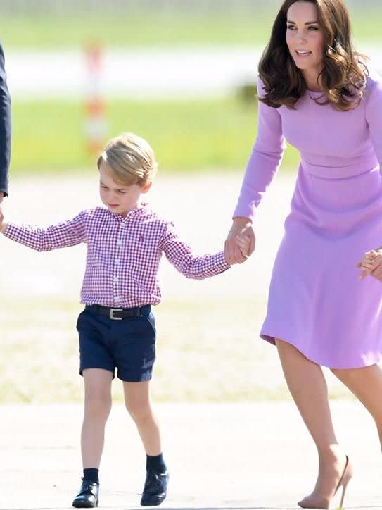 Kate, pictured here with George in Germany in July, missed her son's first day of school. Source: Getty